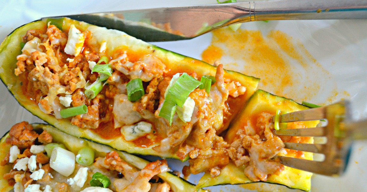 Buffalo chicken zucchini boats - served on a plate and ready to eat