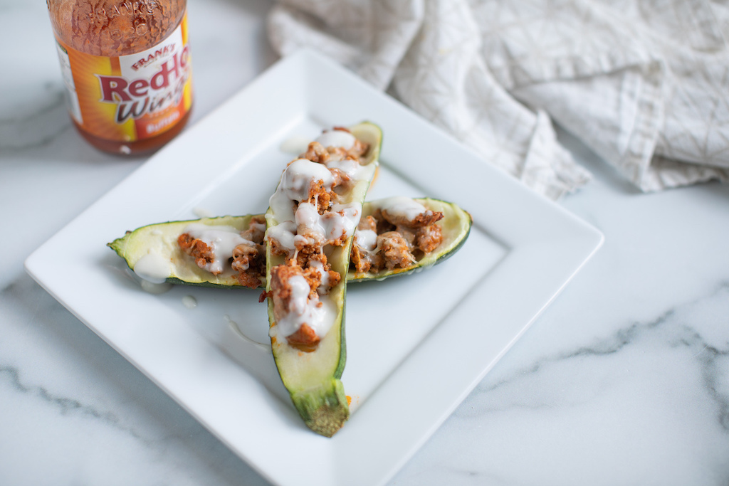 buffalo chicken zucchini boats with buffalo wing sauce