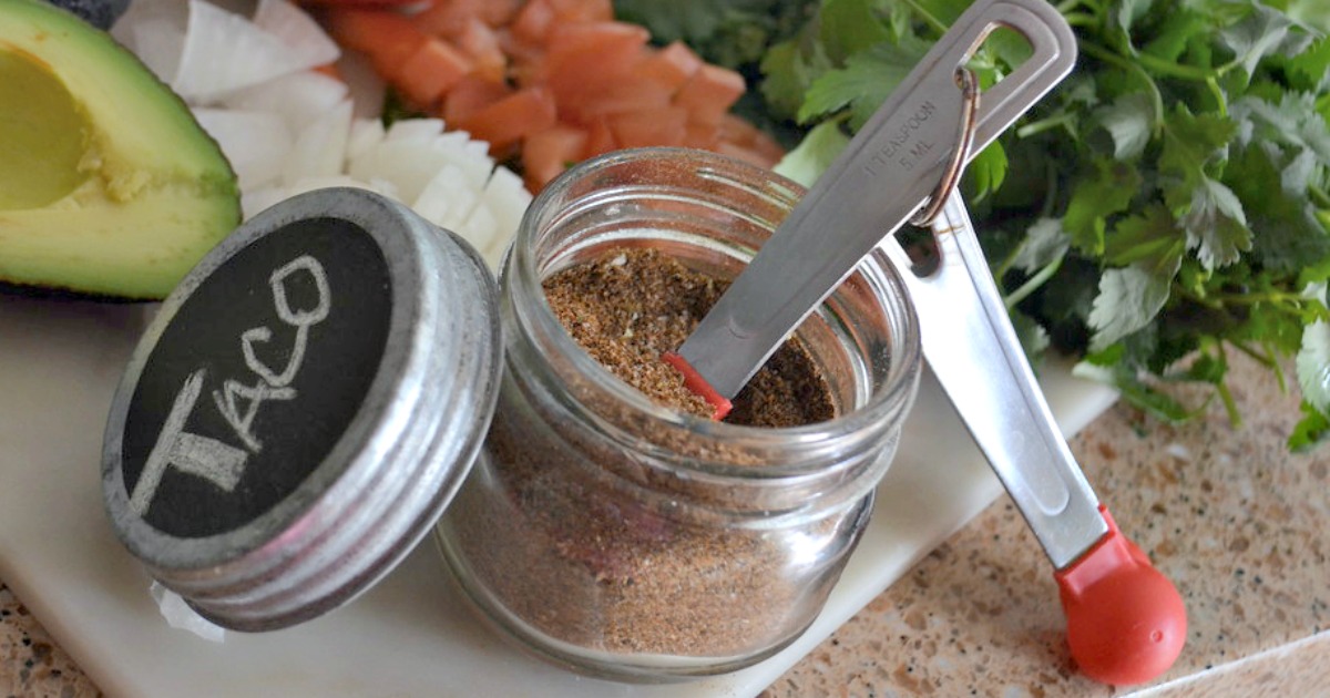 homemade taco seasoning in a jar with a measuring spoon