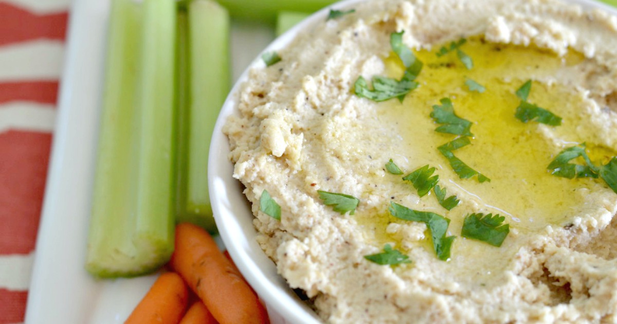 keto roasted cauliflower hummus served in a bowl with fresh vegetables