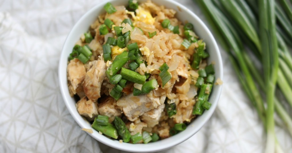 keto cauliflower fried rice in bowl with green onions 