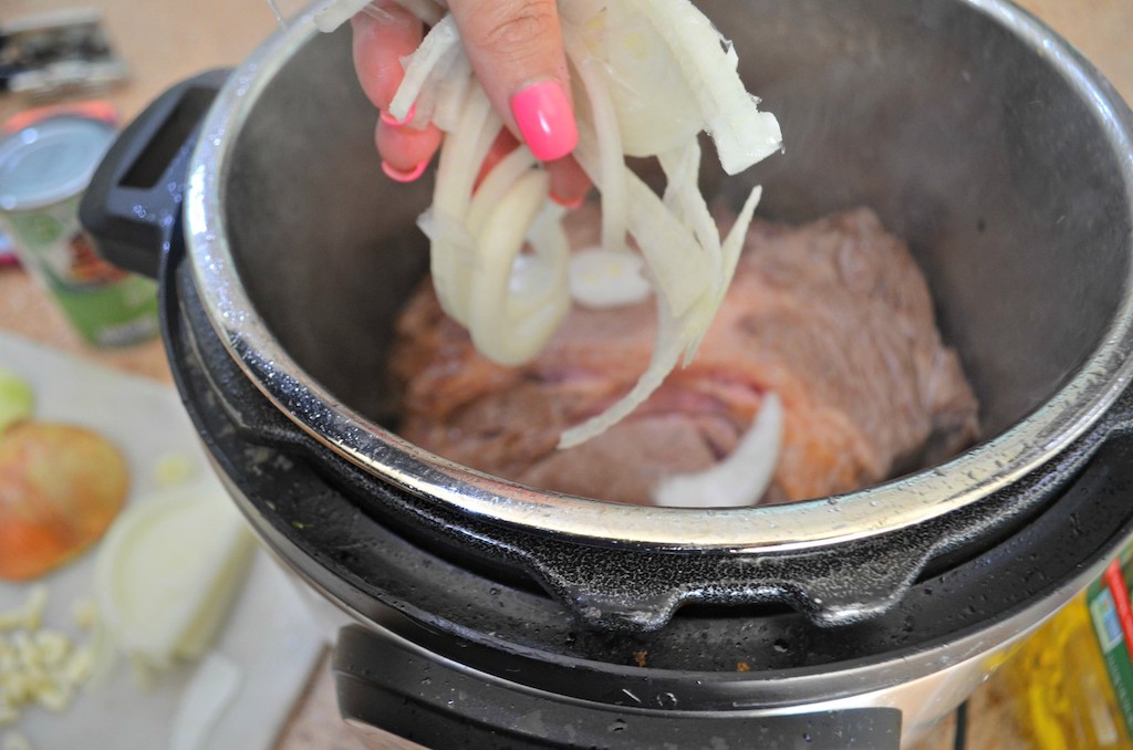 putting onions in instant pot with beef roast 