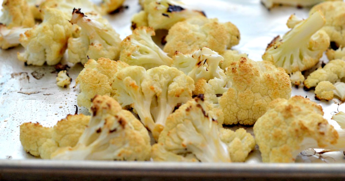 keto roasted cauliflower hummus recipe on a baking pan just out of the oven