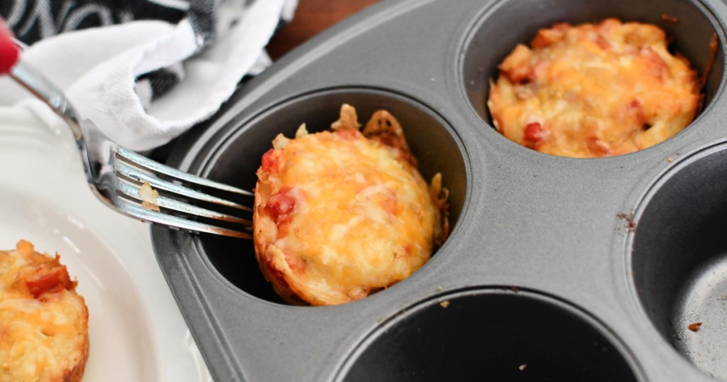 sausage muffins in a large muffin tin after cooking