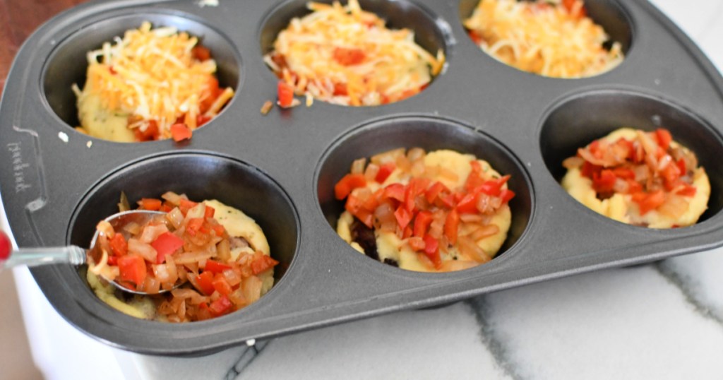 topping breakfast muffins with sauteed veggies