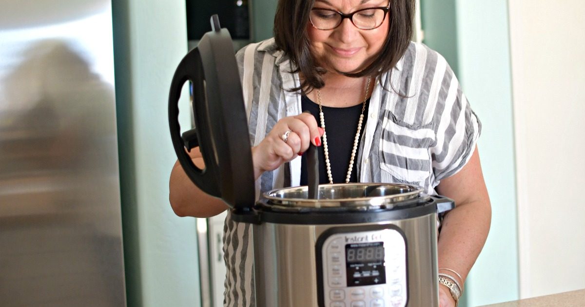 woman cooking with instant pot