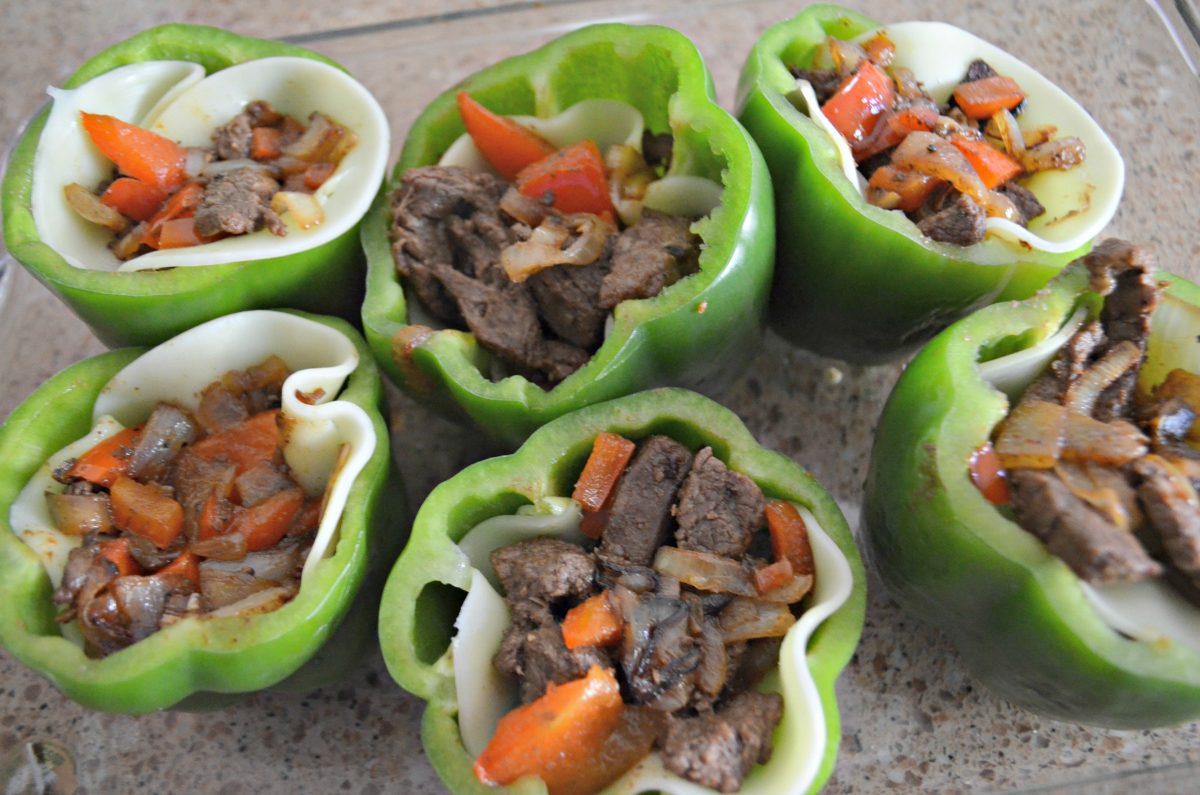 Stuff the green peppers with the meat, cheese, and vegetables