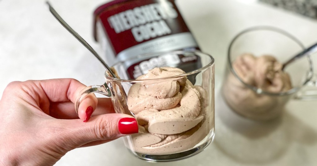 hand holding homemade Frosty in glass mug