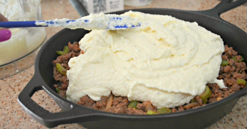 spreading cauliflower mash on keto shepherd's pie 