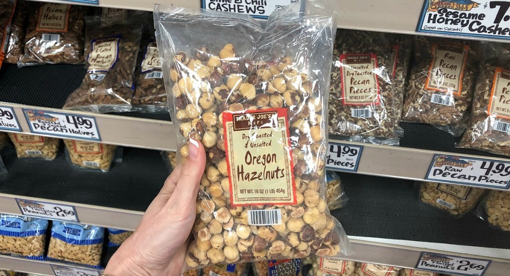 holding bag of raw Oregon hazelnuts