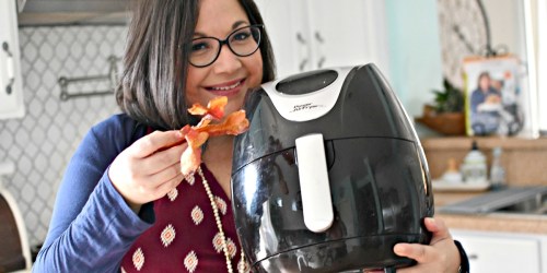woman-holding-power-xl-air-fryer-and-bac