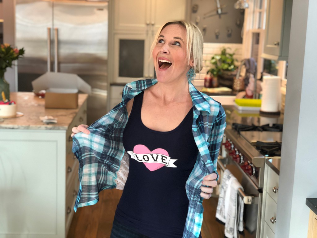 woman wearing tank top that says love on it with plaid shirt