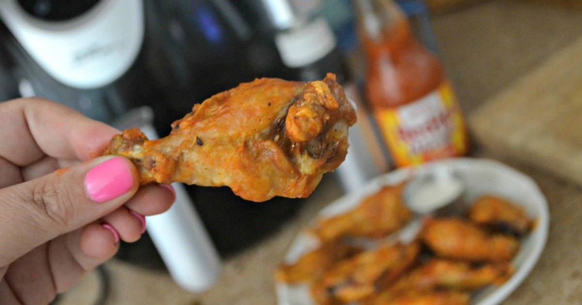 best keto wing recipe - held in Lina's hand