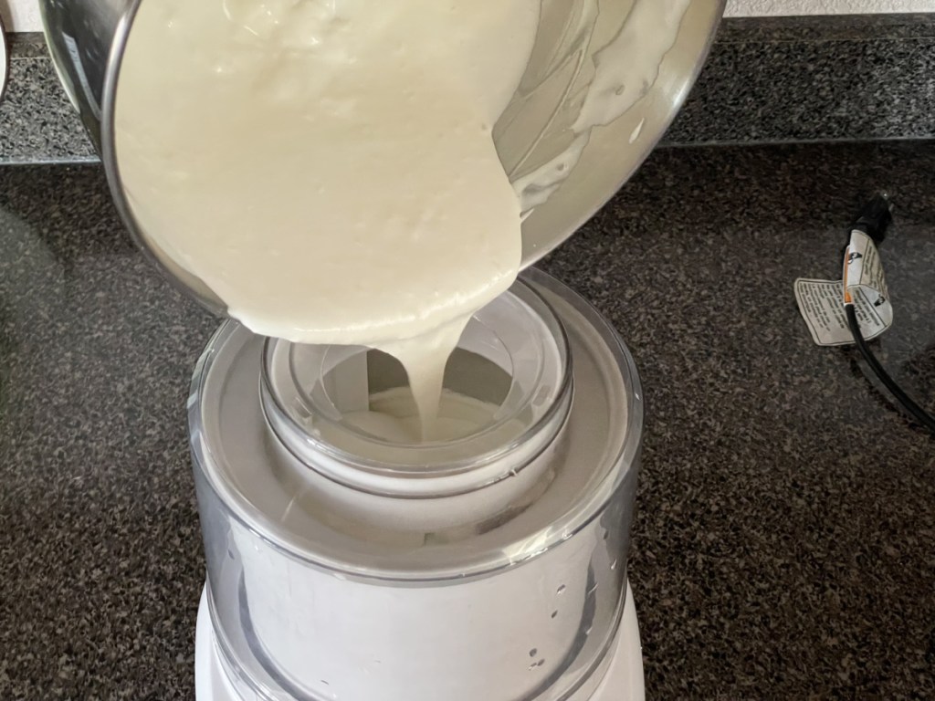adding ice cream base to ice cream maker 