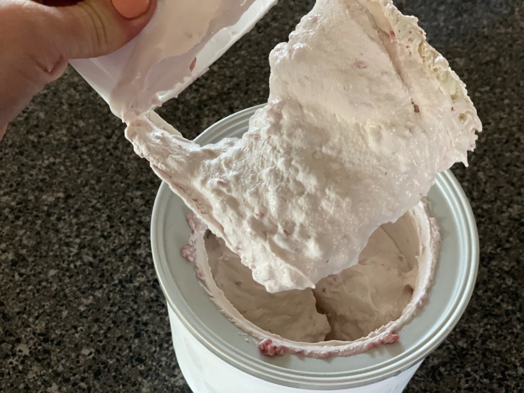 keto raspberry cheesecake ice cream in ice cream maker 