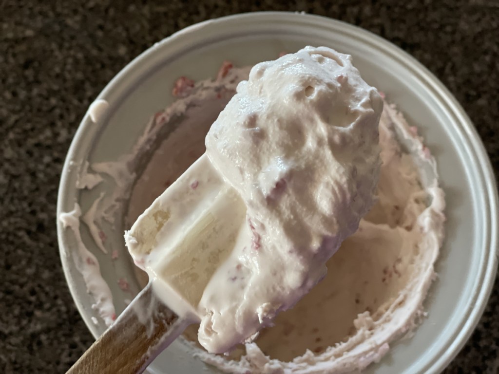 scooping raspberry cheesecake ice cream