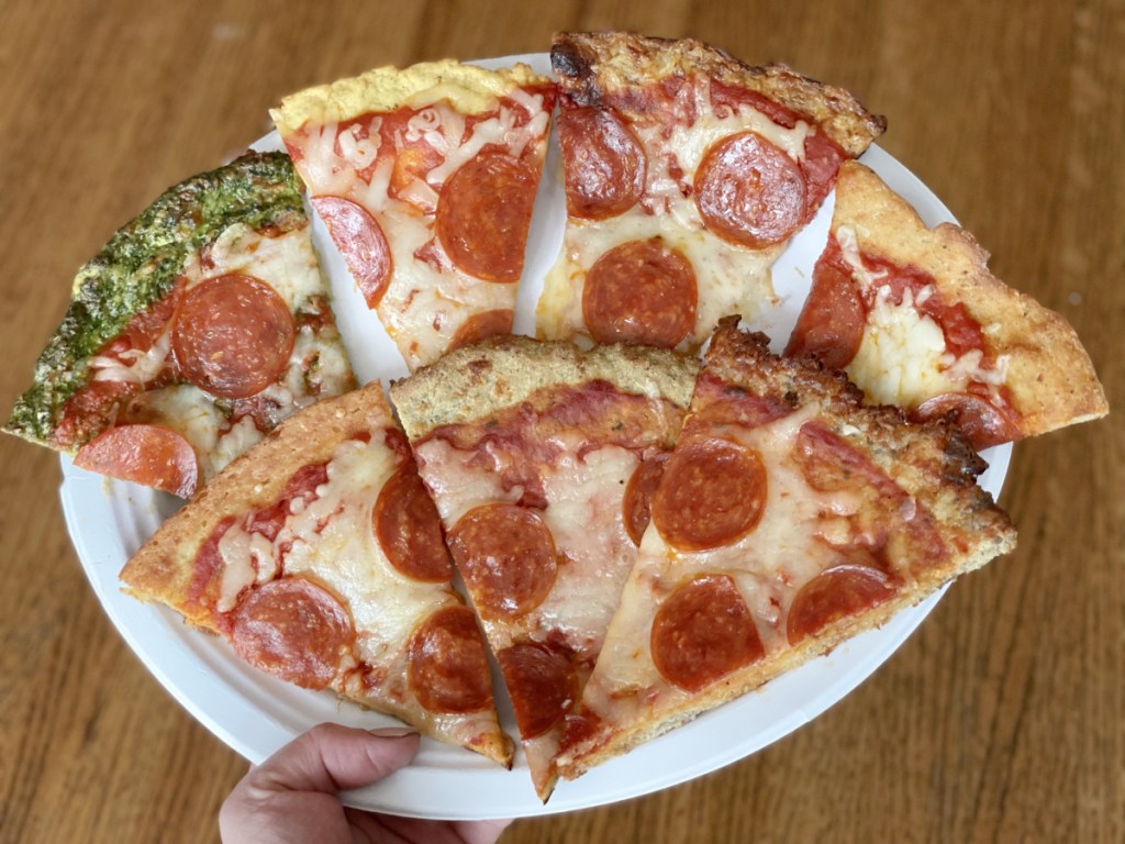 keto pizza crusts seven slices of pizza on a plate