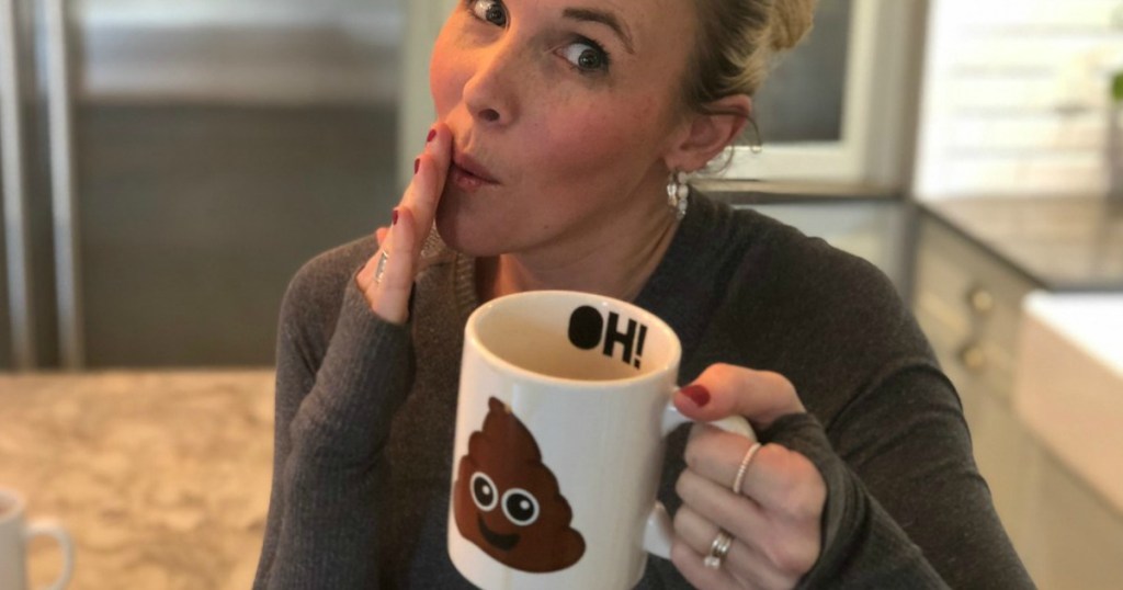 woman holding poop coffee mug