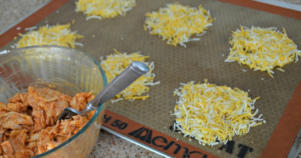 a bowl of chicken and cheese rounds on a silpat baking mat