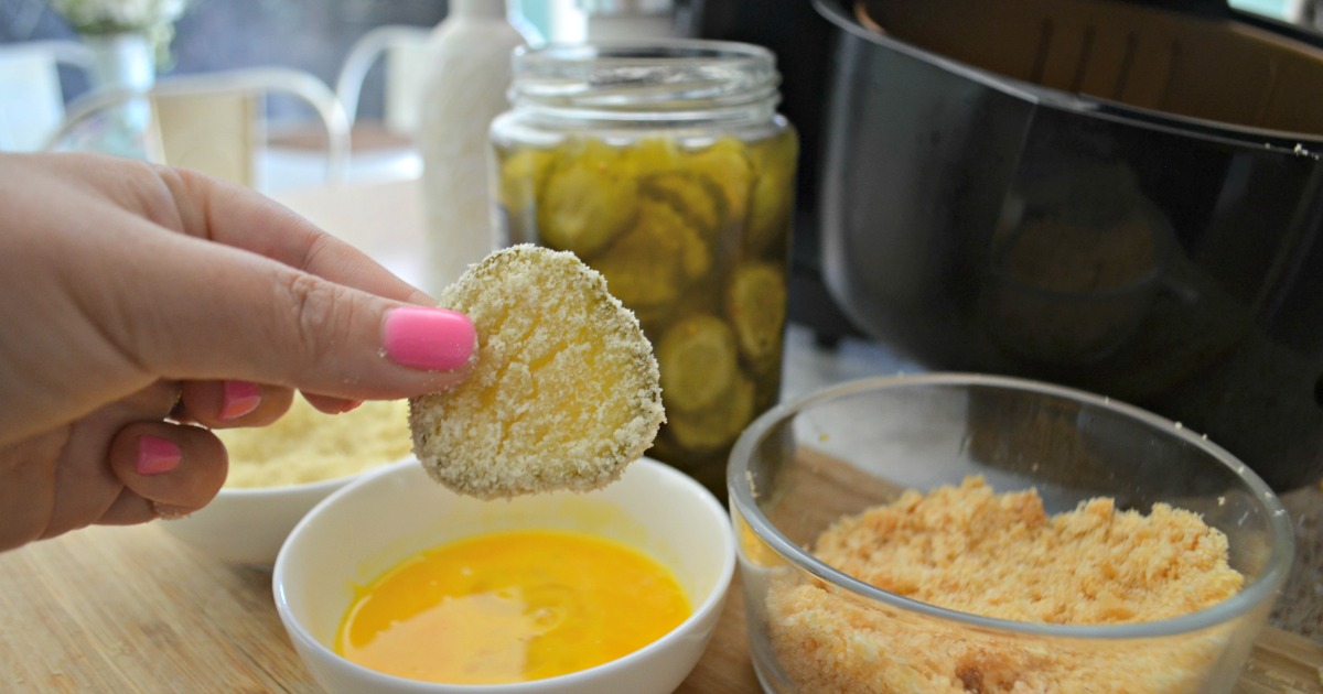 crunchy air fryer fried pickles – dipping pickles in egg dip