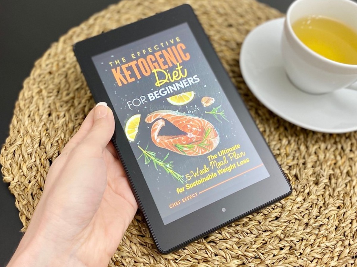 hand holding Kindle showing cover of Keto Diet Book