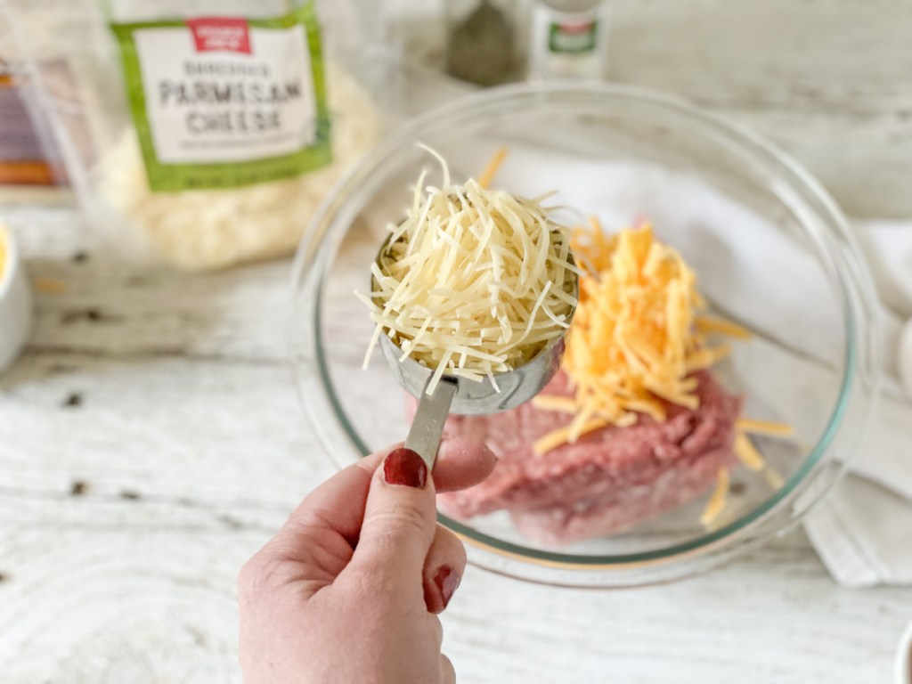 adding parmesan to ground beef mixture