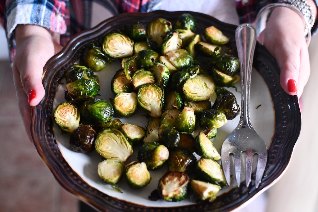 holding plate of brussels sprouts 