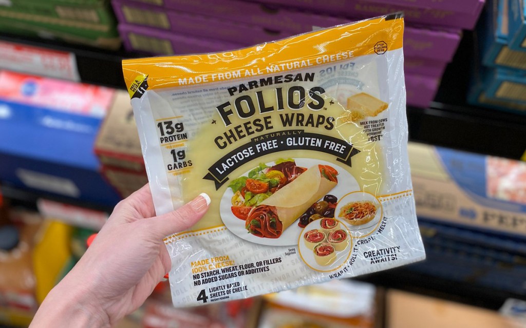 hand holding package of folios cheese wraps