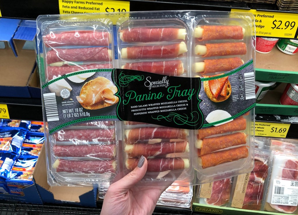 hand holding panino meat tray at aldi