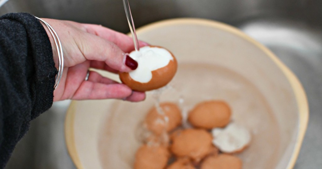 running water to peel hard-boiled eggs