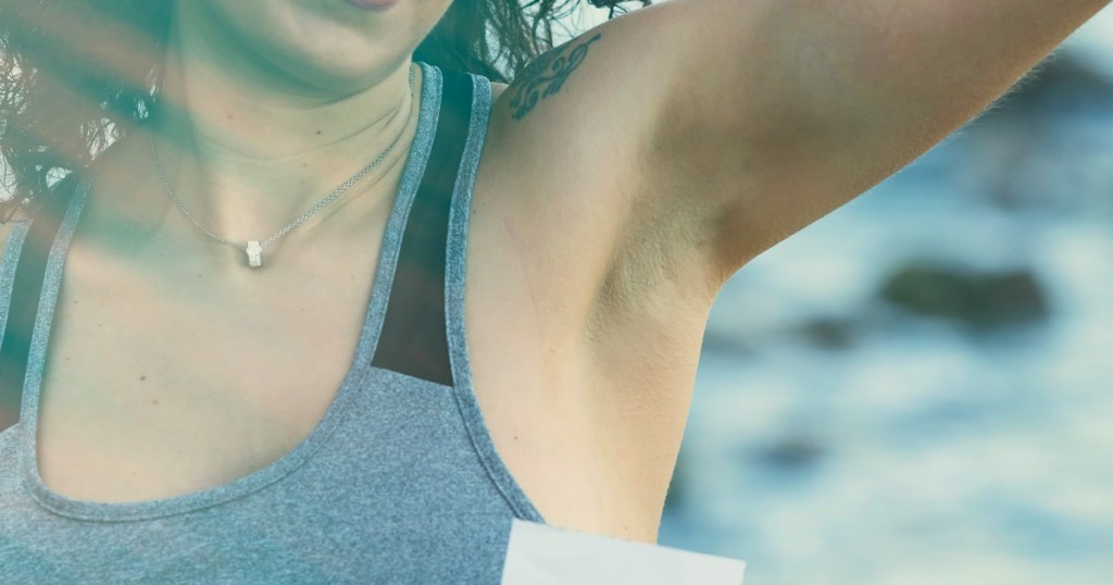 woman with arm raised showing underarm