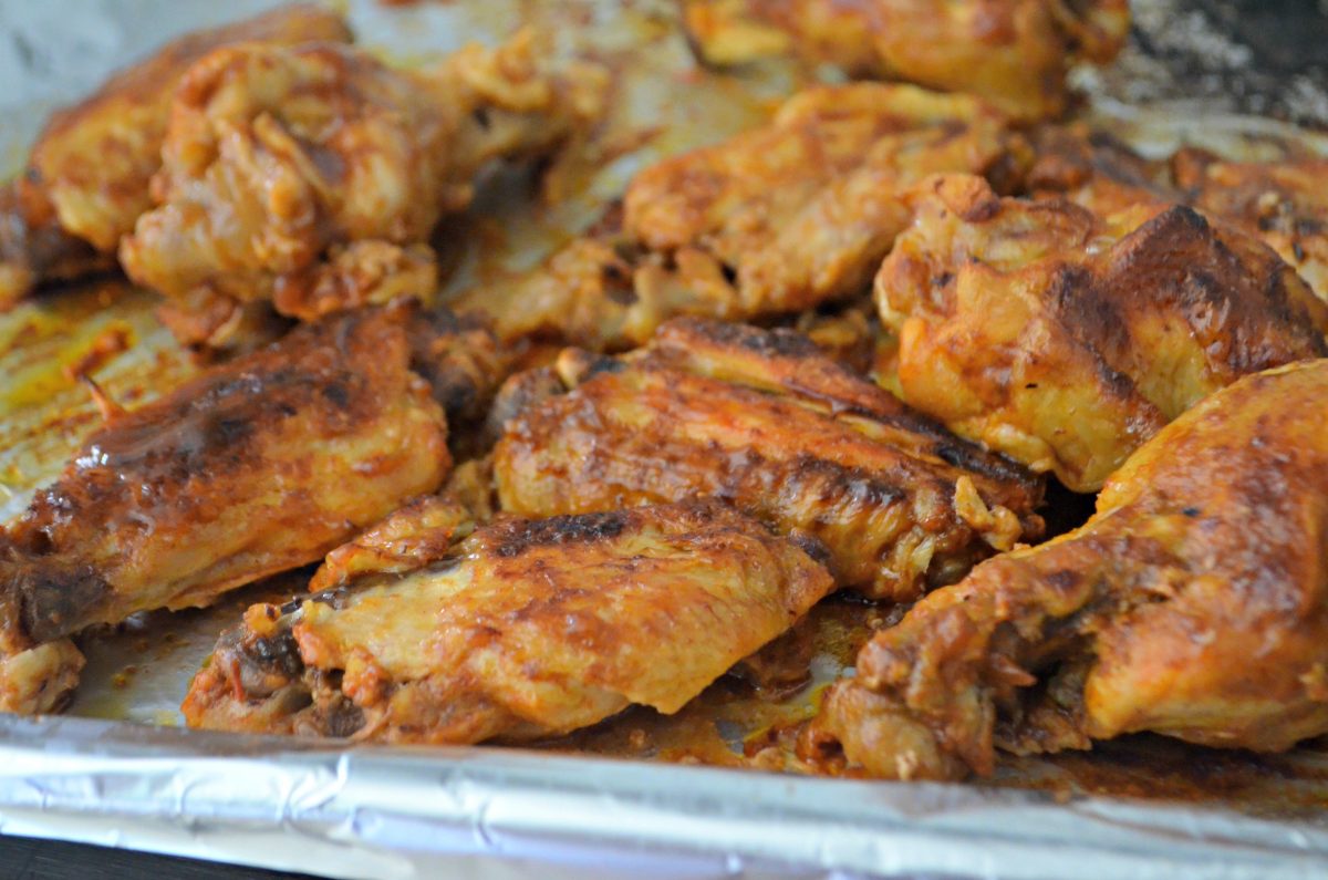 Slow Cooker Buffalo BBQ keto Wings - closeup of the wings on a baking sheet