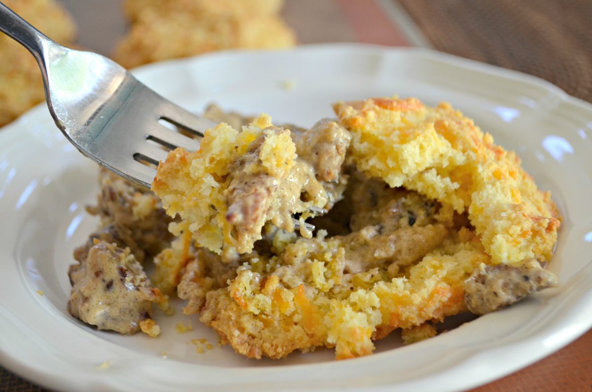 Keto Biscuits and Gravy - on a plate with a fork grabbing a bite to eat