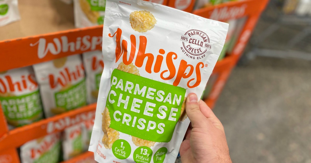 person holding a bag of cheese whisps, some of our favorite keto staples 
