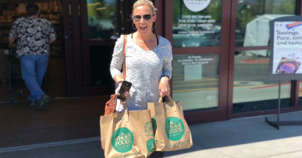 woman at whole foods with shopping bags
