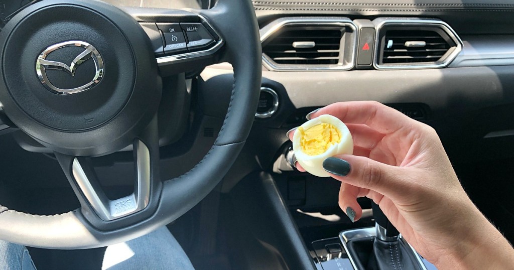 eating hard boiled egg in car for on the go snack