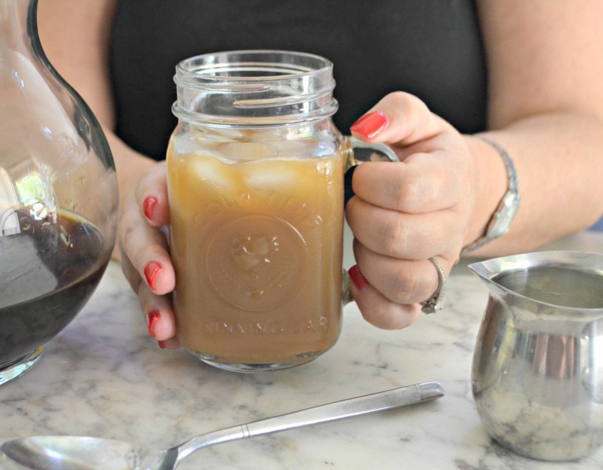 delicious keto cold brew coffee – Lina holding a mug of coffee