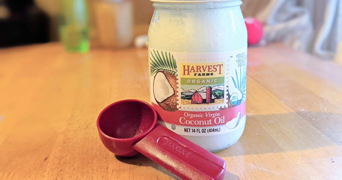 coconut oil with spoon - coconut oil benefits