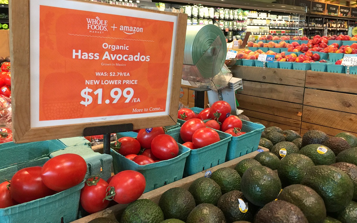 keto whole foods shopping tips to save money — display of hass avocados