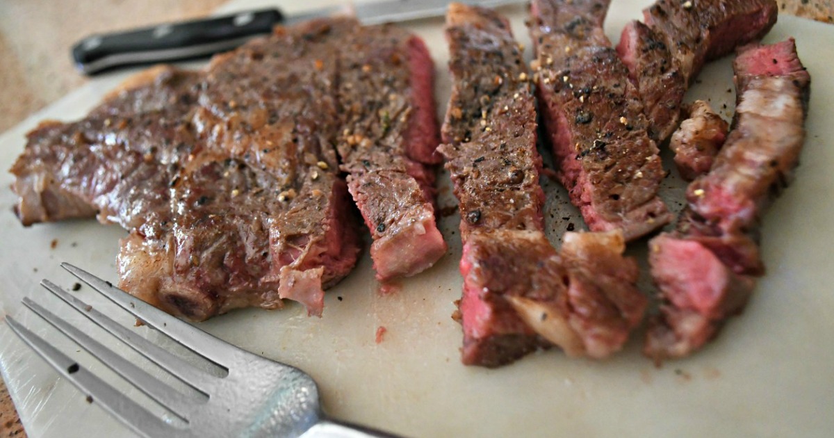 cutting into ribeye