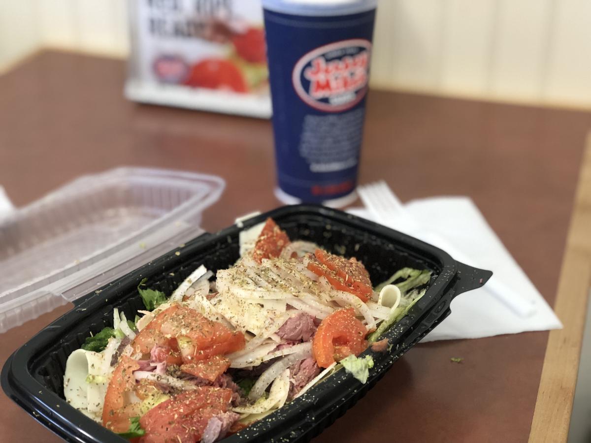 Jersey Mikes Sub in a Tub pictured next to a drink