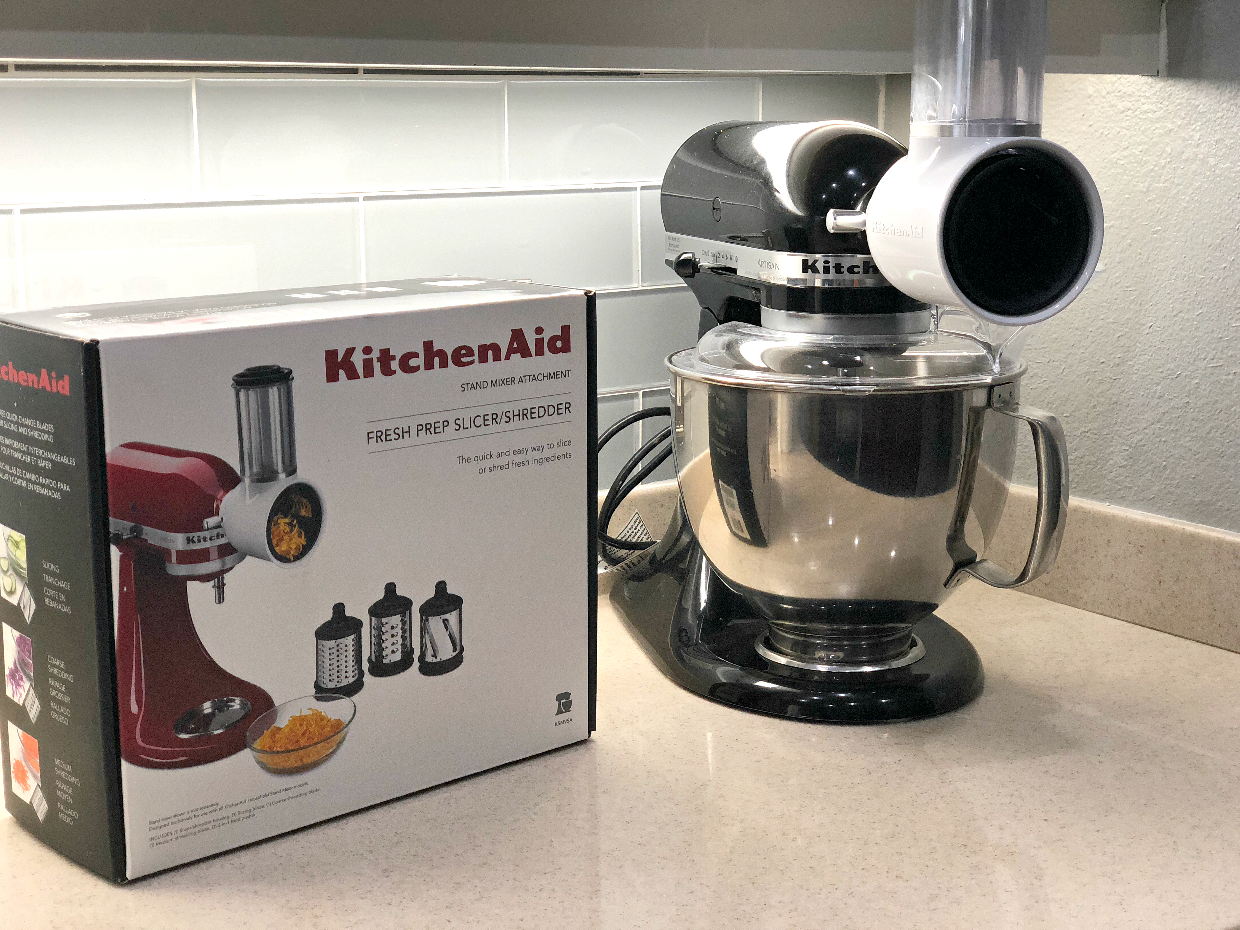This KitchenAid slicer and shredder attachment pictured next to the box is awesome for the keto diet and saves money