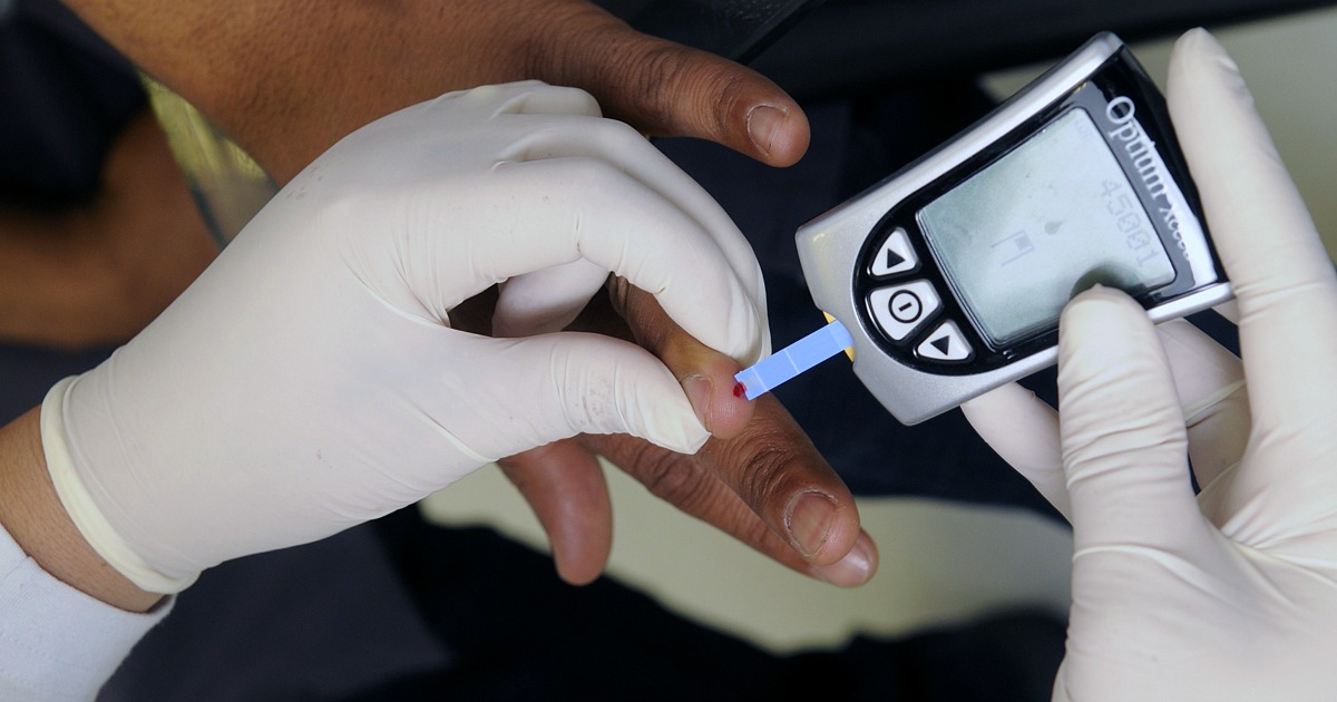 pricking a finger for a blood reading