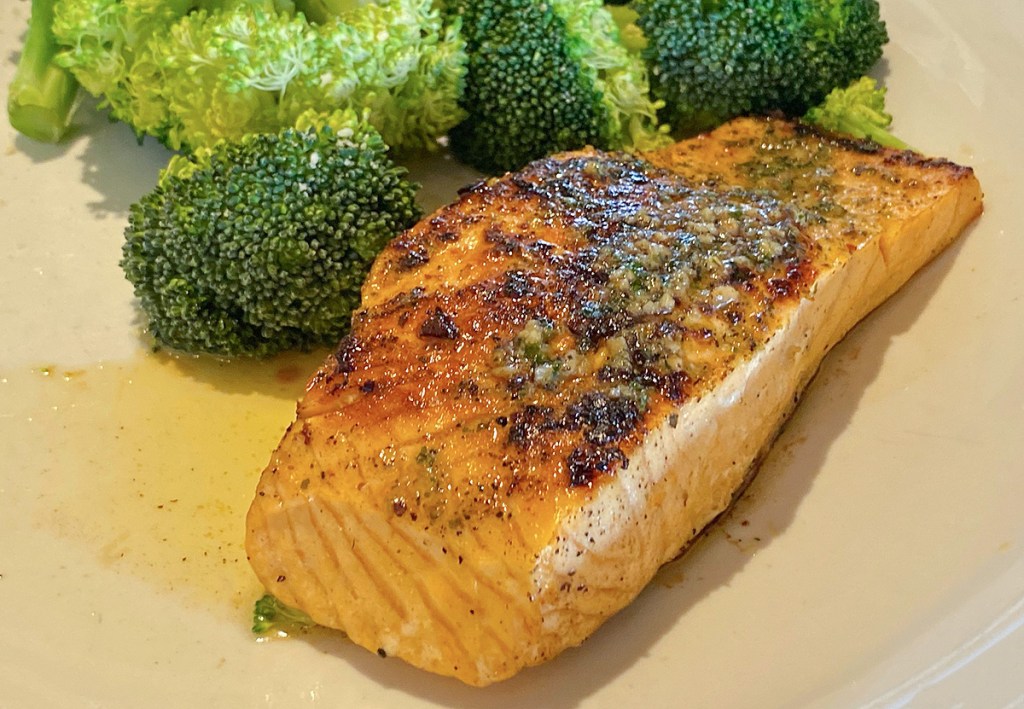 grilled salmon on a plate with broccoli