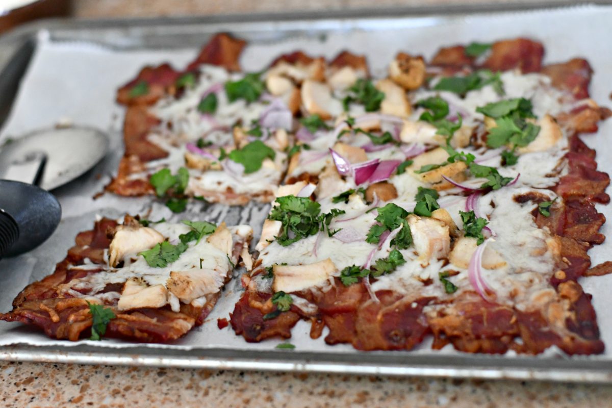 Keto BBQ Chicken Bacon Weave Pizza – cutting the bacon after cooking