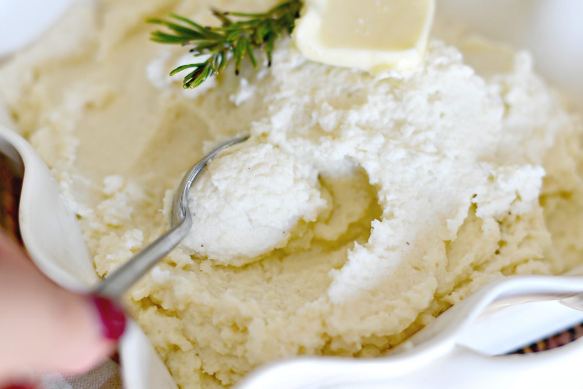 Easy Keto Cauliflower Mashed Potatoes – Adding seasoning to the serving bowl