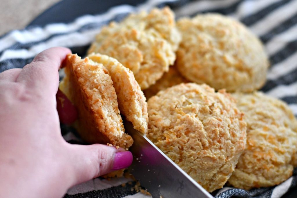 slicing into keto biscuit 