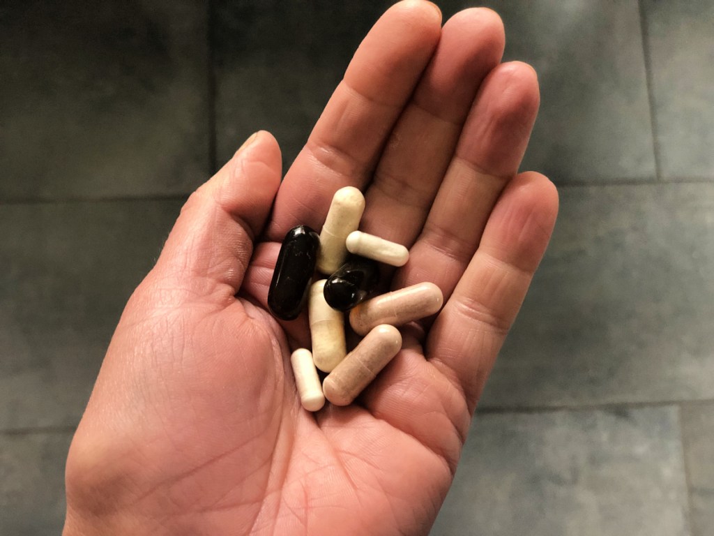 best keto supplements - handful of supplements 