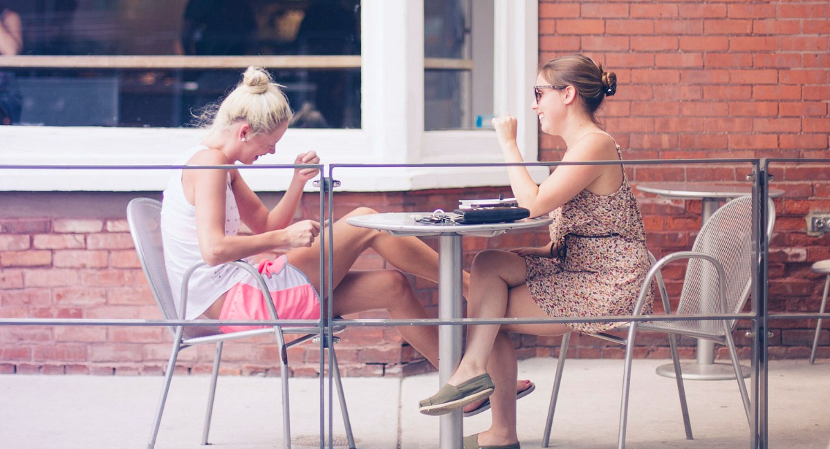 two girls talking outside