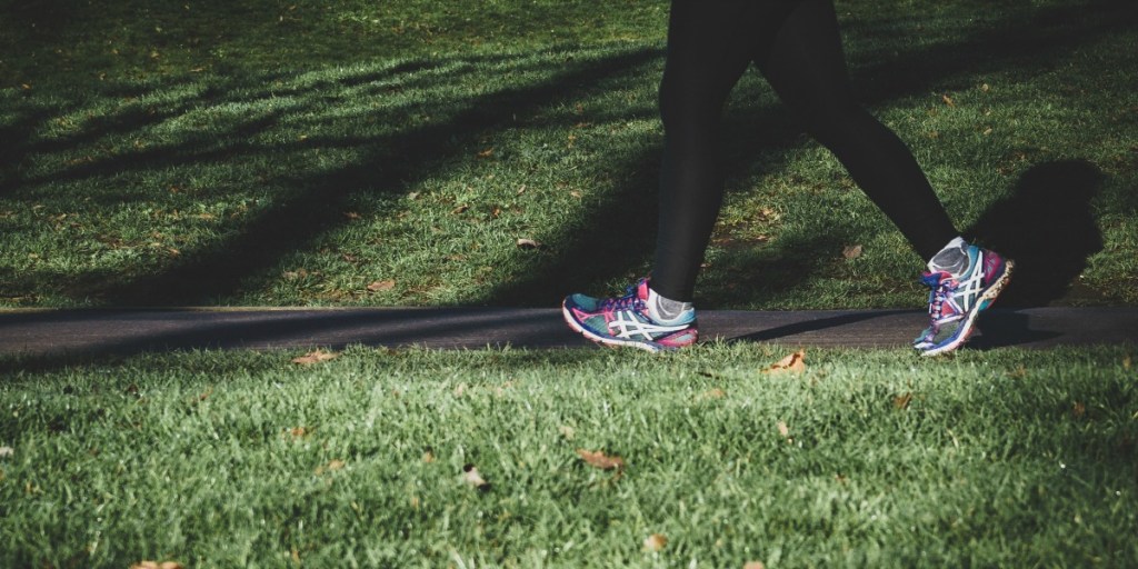 walking with black leggings and sneakers